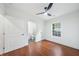Well-lit bedroom boasts hardwood floors, fresh paint, and a view to the green outdoors at 2822 Waters Sw Rd, Atlanta, GA 30354