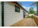 Exterior view of a newly constructed deck and white siding with black trim at 2822 Waters Sw Rd, Atlanta, GA 30354