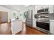 Bright kitchen featuring stainless steel appliances, white cabinets, island, and modern finishes at 2822 Waters Sw Rd, Atlanta, GA 30354