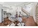 Open-concept living space with kitchen, dining area, and living room featuring hardwood floors at 2822 Waters Sw Rd, Atlanta, GA 30354