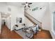 Bright living room featuring hardwood floors, vaulted ceiling, and a staircase with modern decor at 2822 Waters Sw Rd, Atlanta, GA 30354