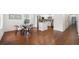 Open-concept living and dining area with hardwood floors seamlessly transitions into the kitchen at 2822 Waters Sw Rd, Atlanta, GA 30354