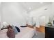 Vaulted ceiling bedroom with hardwood floors and a bright view into the ensuite bath at 2822 Waters Sw Rd, Atlanta, GA 30354