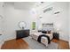 Bright main bedroom with soaring ceilings, hardwood floors, and modern decor at 2822 Waters Sw Rd, Atlanta, GA 30354