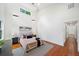 Bright bedroom with hardwood floors, high ceilings, large windows, and adjacent bathroom at 2822 Waters Sw Rd, Atlanta, GA 30354
