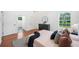 Main bedroom with view of full bath, hardwood floors and light-filled windows at 2822 Waters Sw Rd, Atlanta, GA 30354