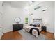 Spacious bedroom with hardwood floors, large windows, and a stylishly appointed bed at 2822 Waters Sw Rd, Atlanta, GA 30354