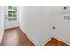 Mud room showing the entry door with wood floors and white walls at 2822 Waters Sw Rd, Atlanta, GA 30354