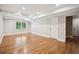 Unfinished basement with recessed lighting, wood-look flooring, and access to additional rooms at 2907 Wickford Dr, Kennesaw, GA 30152