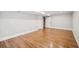 Unfinished basement with wood flooring and white doors at 2907 Wickford Dr, Kennesaw, GA 30152