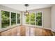 A bright dining area features beautiful windows with a view of the trees and a modern chandelier at 2907 Wickford Dr, Kennesaw, GA 30152