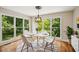 Bright dining area features beautiful windows offering natural light, a chandelier, and contemporary decor at 2907 Wickford Dr, Kennesaw, GA 30152