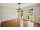 Bright dining room with hardwood floors, natural light, and modern chandelier at 2907 Wickford Dr, Kennesaw, GA 30152