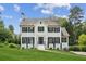 Charming two-story home features a white brick facade, black shutters, and a well-manicured lawn at 2907 Wickford Dr, Kennesaw, GA 30152