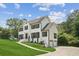 Side view of a well-maintained house, white brick and siding, attached garage, and lush green lawn at 2907 Wickford Dr, Kennesaw, GA 30152
