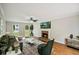 Bright living room with fireplace, hardwood floors, comfortable seating, and modern decor at 2907 Wickford Dr, Kennesaw, GA 30152