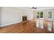 Bright living room features a fireplace, hardwood floors, and access to a private deck and door to the backyard at 2907 Wickford Dr, Kennesaw, GA 30152
