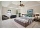 Spacious main bedroom suite featuring a king bed, ceiling fan, and neutral decor at 2907 Wickford Dr, Kennesaw, GA 30152