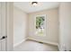 Neutral-toned room featuring tile flooring and a bright window, offering a versatile space at 2907 Wickford Dr, Kennesaw, GA 30152