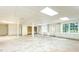 Finished basement with white support columns, built-in cabinets, and bright windows at 5287 Vernon Lake Dr, Atlanta, GA 30338