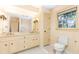 Bathroom featuring double vanity, storage space, and natural light at 5287 Vernon Lake Dr, Atlanta, GA 30338