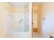Bathroom featuring a white tiled shower and separate door at 5287 Vernon Lake Dr, Atlanta, GA 30338