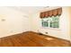 Bedroom with wooden floors, a view to the backyard and closet at 5287 Vernon Lake Dr, Atlanta, GA 30338