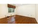 Bedroom with wood floors, large window, neutral colors, and recessed lighting at 5287 Vernon Lake Dr, Atlanta, GA 30338