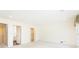 Bright bedroom with neutral carpet, and doorway to ensuite bathroom and closet at 5287 Vernon Lake Dr, Atlanta, GA 30338