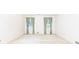 Spacious bedroom with two windows and light carpet flooring at 5287 Vernon Lake Dr, Atlanta, GA 30338