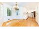 Bright dining area connects to kitchen and features hardwood floors, chandelier, and large windows at 5287 Vernon Lake Dr, Atlanta, GA 30338