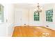 Cozy dining area offers hardwood floors and natural light through bright windows at 5287 Vernon Lake Dr, Atlanta, GA 30338