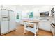Clean kitchen features white cabinets, stainless appliances, and a center island for convenient meal prep at 5287 Vernon Lake Dr, Atlanta, GA 30338