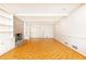 Cozy living room features brick fireplace, parquet floors, built-in shelving, and white trim at 5287 Vernon Lake Dr, Atlanta, GA 30338