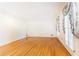 Spacious living room with gleaming hardwood floors, crown molding and decorative window treatments at 5287 Vernon Lake Dr, Atlanta, GA 30338