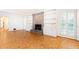 Spacious living room features wood floors, brick fireplace, and built-in shelving at 5287 Vernon Lake Dr, Atlanta, GA 30338