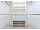 Well-organized walk-in closet with custom shelving and hanging rods at 5287 Vernon Lake Dr, Atlanta, GA 30338