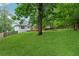 Large backyard of home includes a deck and extensive lawn at 12290 Greenmont Walk, Alpharetta, GA 30009