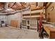 Unfinished basement featuring open ceilings, concrete walls, shelving and utility features at 12290 Greenmont Walk, Alpharetta, GA 30009