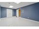 Finished basement space showing closet and a storage or utility room for flexible use at 12290 Greenmont Walk, Alpharetta, GA 30009