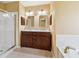 Bathroom featuring a double vanity, a glass shower, and a soaking tub at 12290 Greenmont Walk, Alpharetta, GA 30009