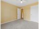 Bedroom with neutral carpet and a double door closet, offering ample storage at 12290 Greenmont Walk, Alpharetta, GA 30009