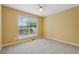 Bedroom featuring neutral paint and carpet, plus large bright window at 12290 Greenmont Walk, Alpharetta, GA 30009