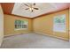 Spacious bedroom with tray ceiling, carpet flooring, and large windows at 12290 Greenmont Walk, Alpharetta, GA 30009