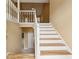 Bright entryway with hardwood floors and a staircase leading to the upper level at 12290 Greenmont Walk, Alpharetta, GA 30009