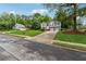 Well-manicured lawn leads to a charming two-story home with a two-car garage at 12290 Greenmont Walk, Alpharetta, GA 30009