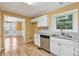 Updated kitchen with stainless appliances, stone counters, subway tile backsplash, and access to the dining room at 12290 Greenmont Walk, Alpharetta, GA 30009