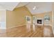Spacious living room with hardwood floors, fireplace, vaulted ceiling, and natural light at 12290 Greenmont Walk, Alpharetta, GA 30009