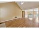 Expansive living room with hardwood floors, high ceiling, and views of the upper level at 12290 Greenmont Walk, Alpharetta, GA 30009