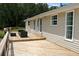 Enjoy the view from the back deck, featuring patio seating and lots of natural light at 3129 Etchison Rd, Loganville, GA 30052